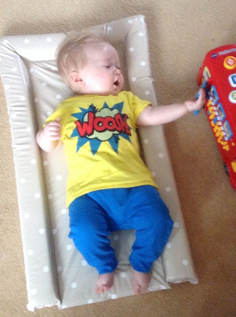 baby fashion, bright blue jogging pants and yellow t shirt with a red woosh in the middle and blue pattern