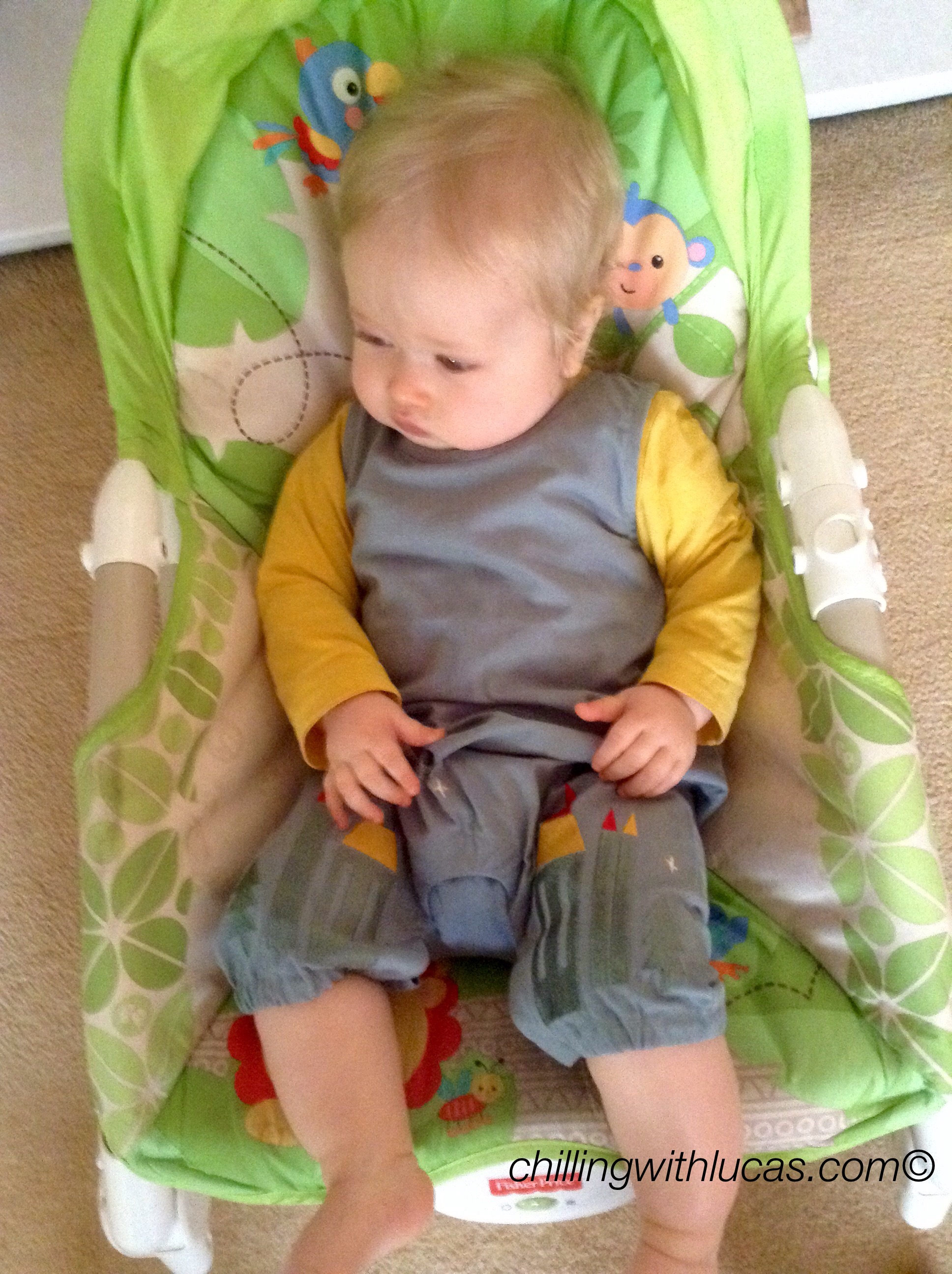 lucas wearing Little green radicals enchanted castles dungarees in the chair