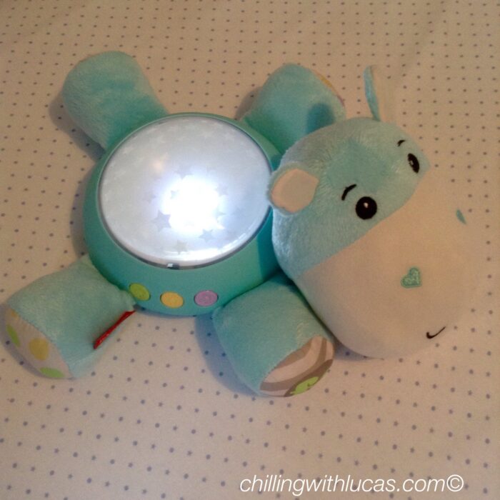 Fisherprice hippo light projection soother in the dark showing it lit up