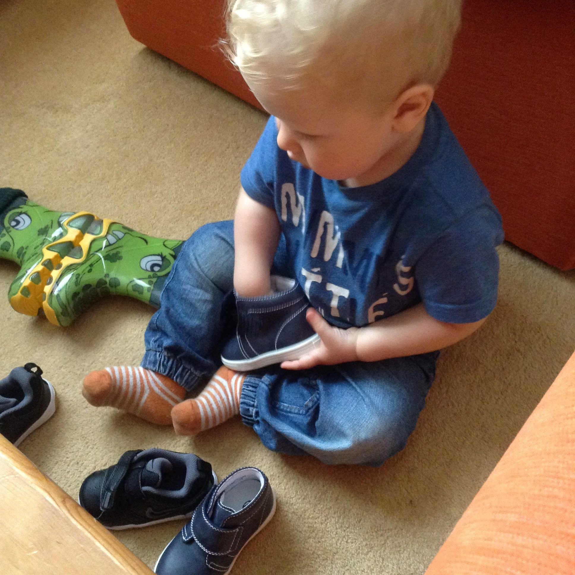 Lucas sat down looking at his new shoes