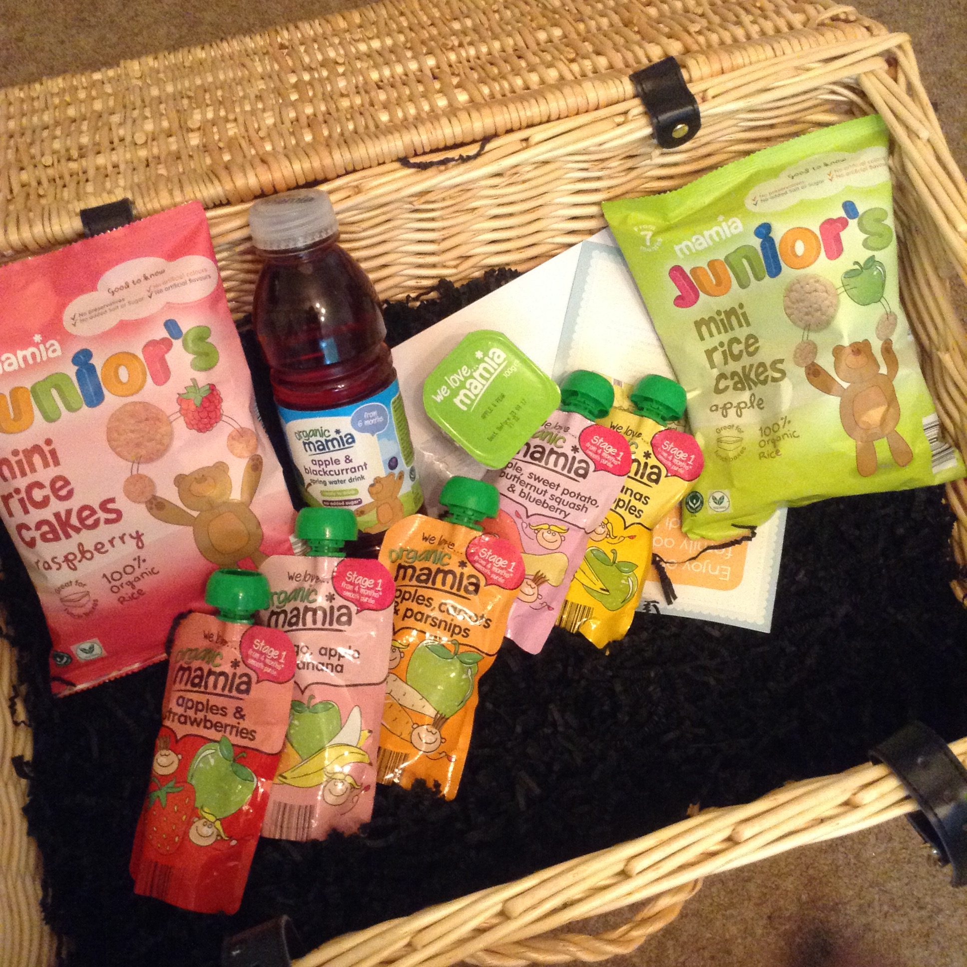 #MamiaDaysOut hamper, a large wicker basket filled with Mamia blackcurrant spring water, fruit puree pouches and rice cakes