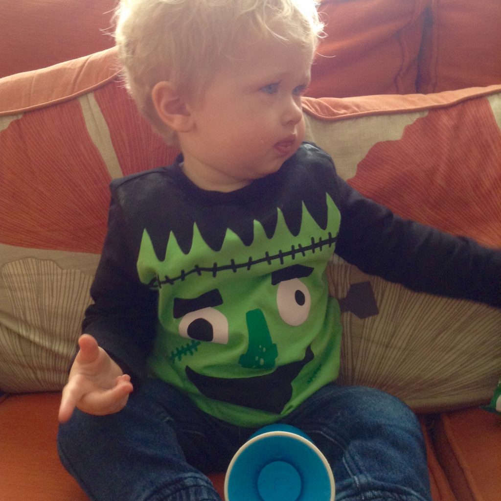 Halloween Lucas wearing a black top with a green monster on it