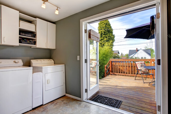 Make your kitchen fit for the whole family. A laundry room going out onto decking garden