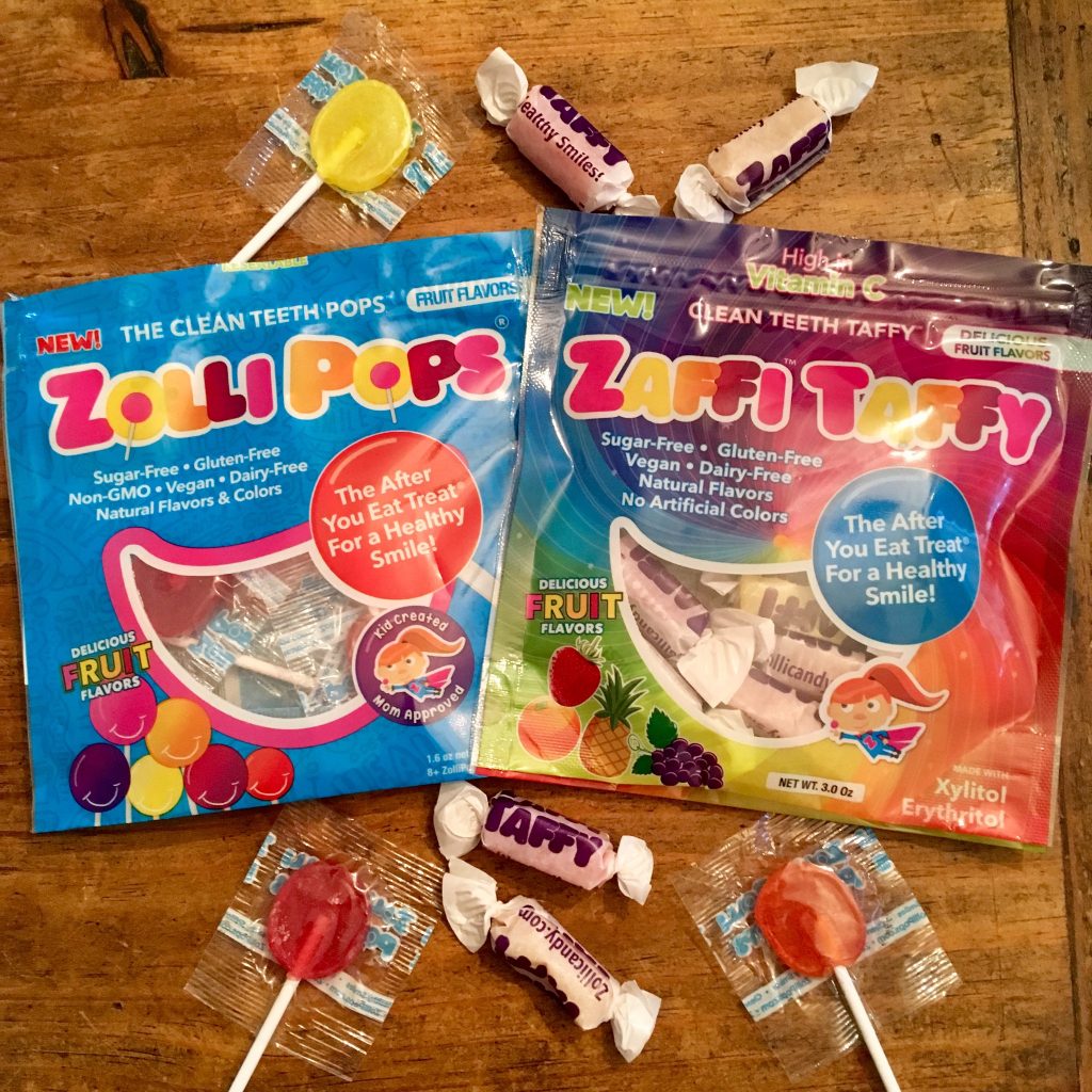 Zollipops and Taft sweets in their packets on a wooden table 