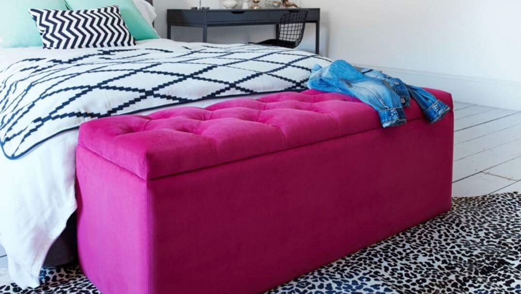 Bedroom storage a bright pink bedding box at the bottom of the bed