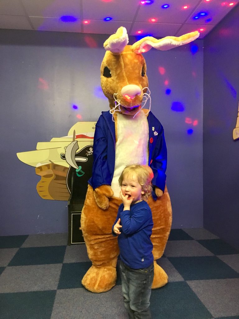 Easter 2018 Lucas is standing in front of a big Easter bunny 