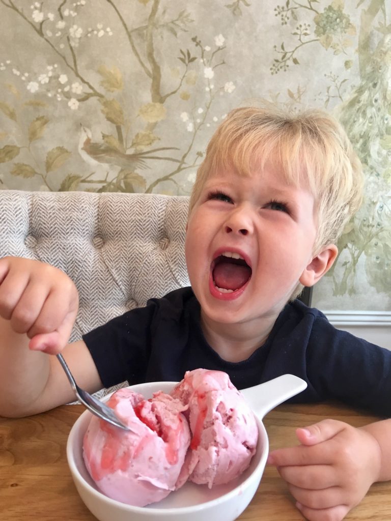 The Brasserie, Lancaster review. Lucas laughing with strawberry ice cream in front of him