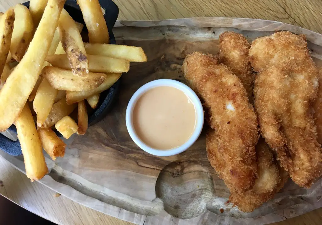 Wheelers of St. James, Liverpool review Chicken goujons and chips in individual bowls on a wooden platter
