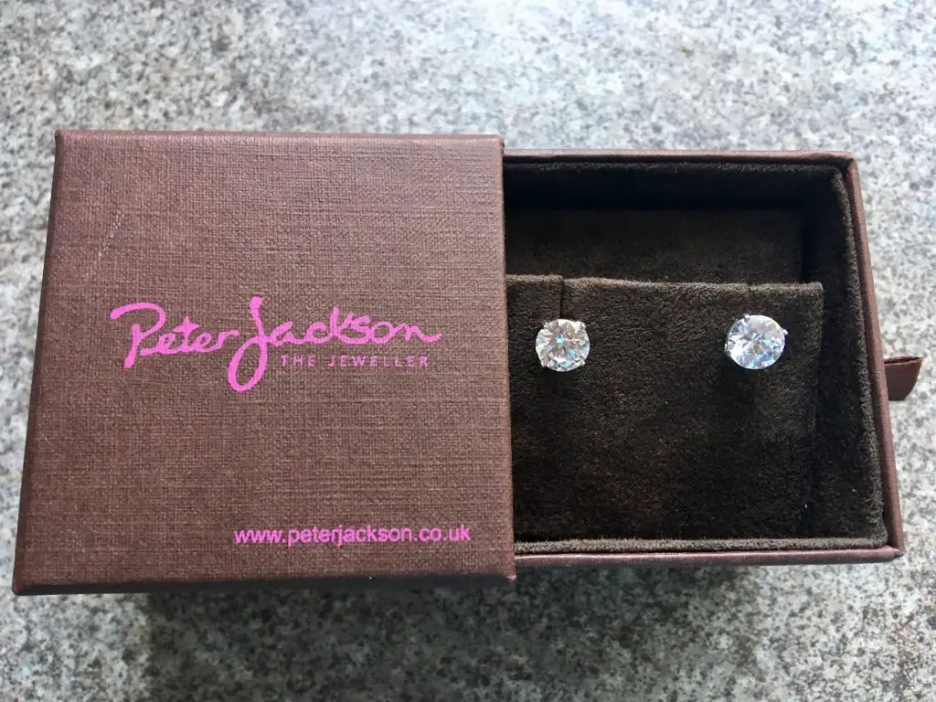 Peter Jackson discount code. The cubic zirconia earrings in a brown branded peter Jackson box