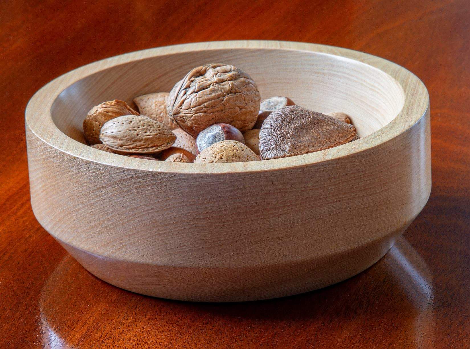 Food and drink gift ideas a wooden bowl with nuts in
