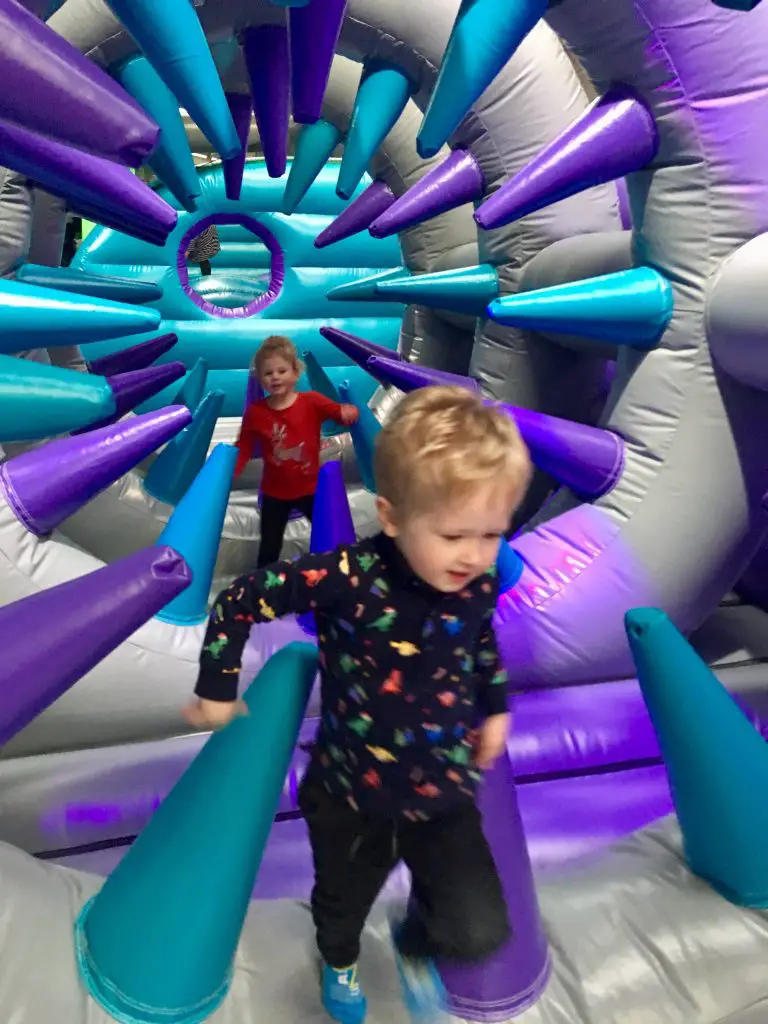 Air Unlimited Burnley review, Lucas and S running through inflatable spikes 