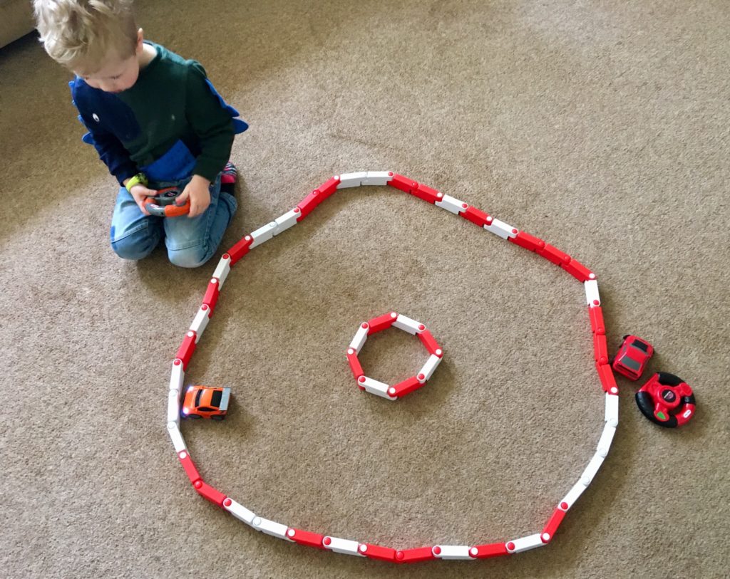 Little Tikes YouDrive review. Lucas playing with the car and the track is in a circle 