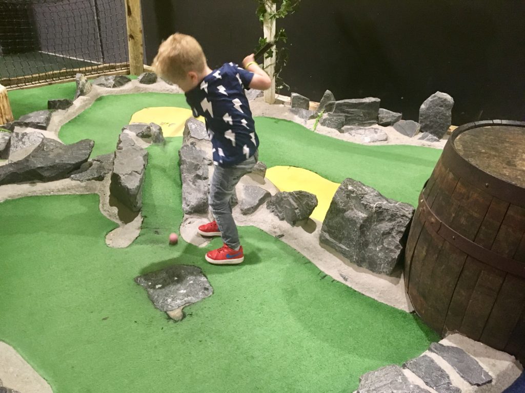 Lucas playing mini golf 