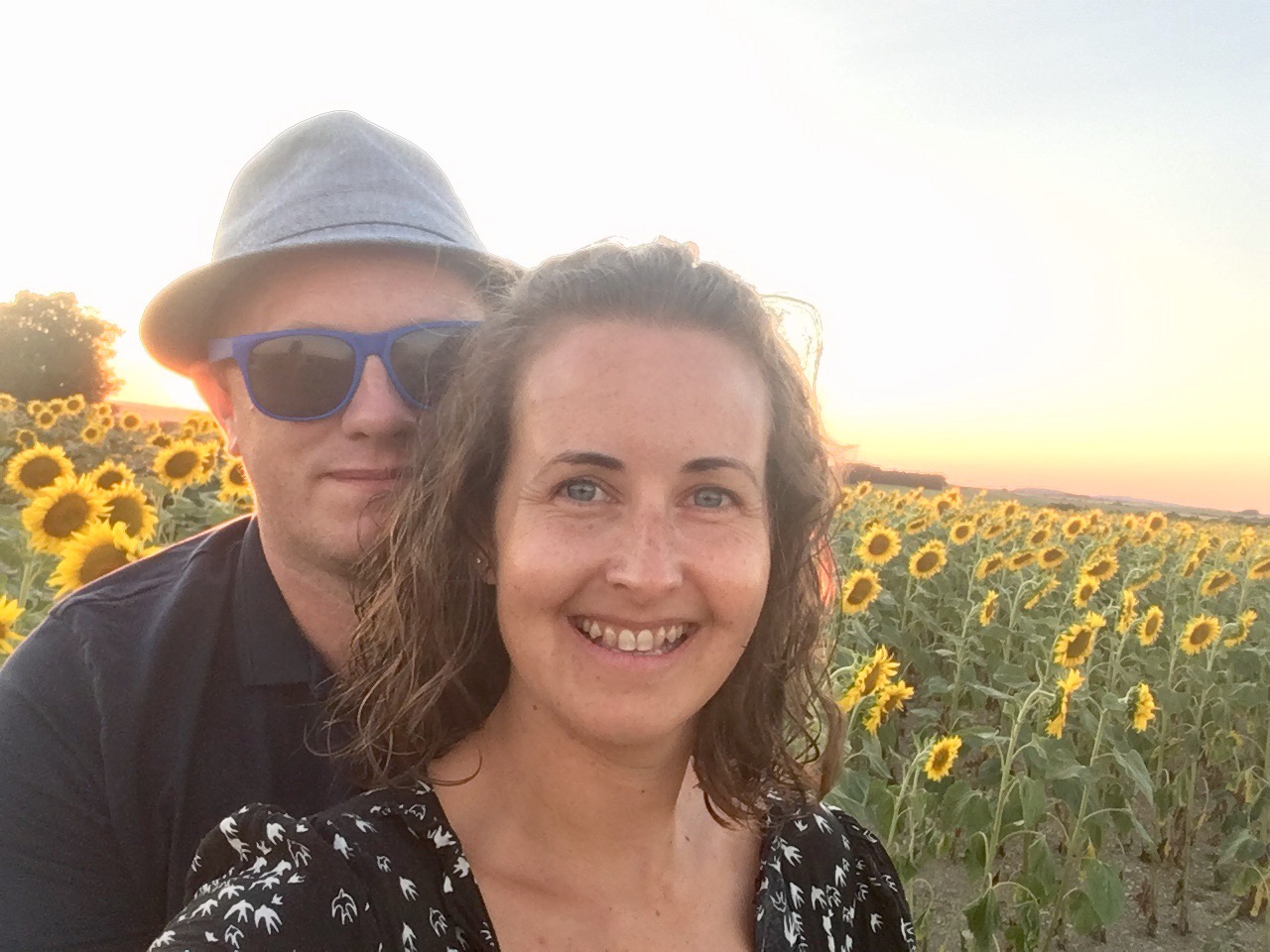 D and I looking at the camera, a field of sunflowers behind us