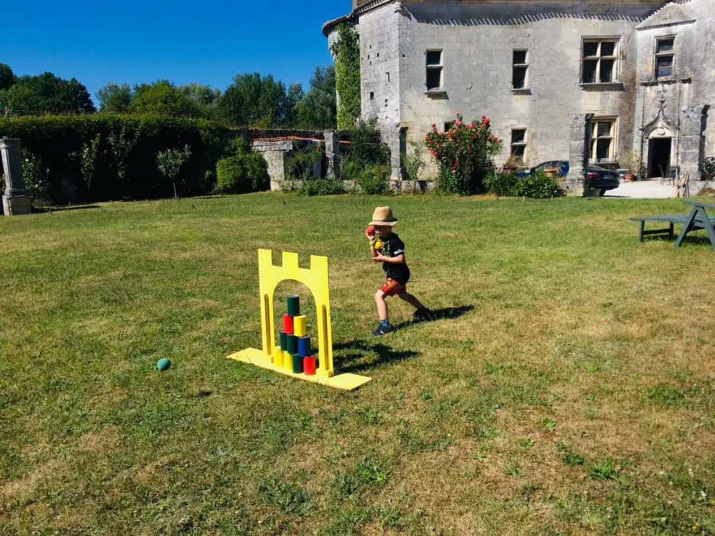 Lucas playing games on the lawn outside Mareuil chateau
