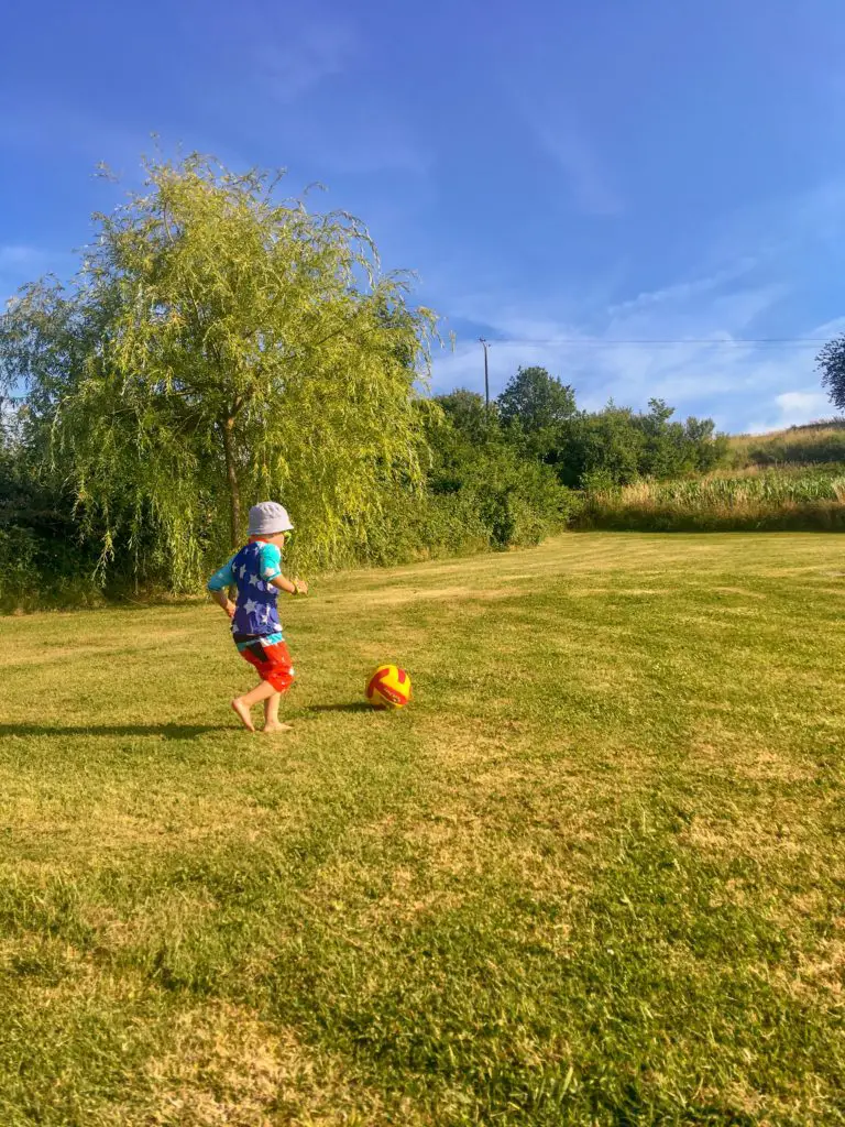 Lucas running playing football 