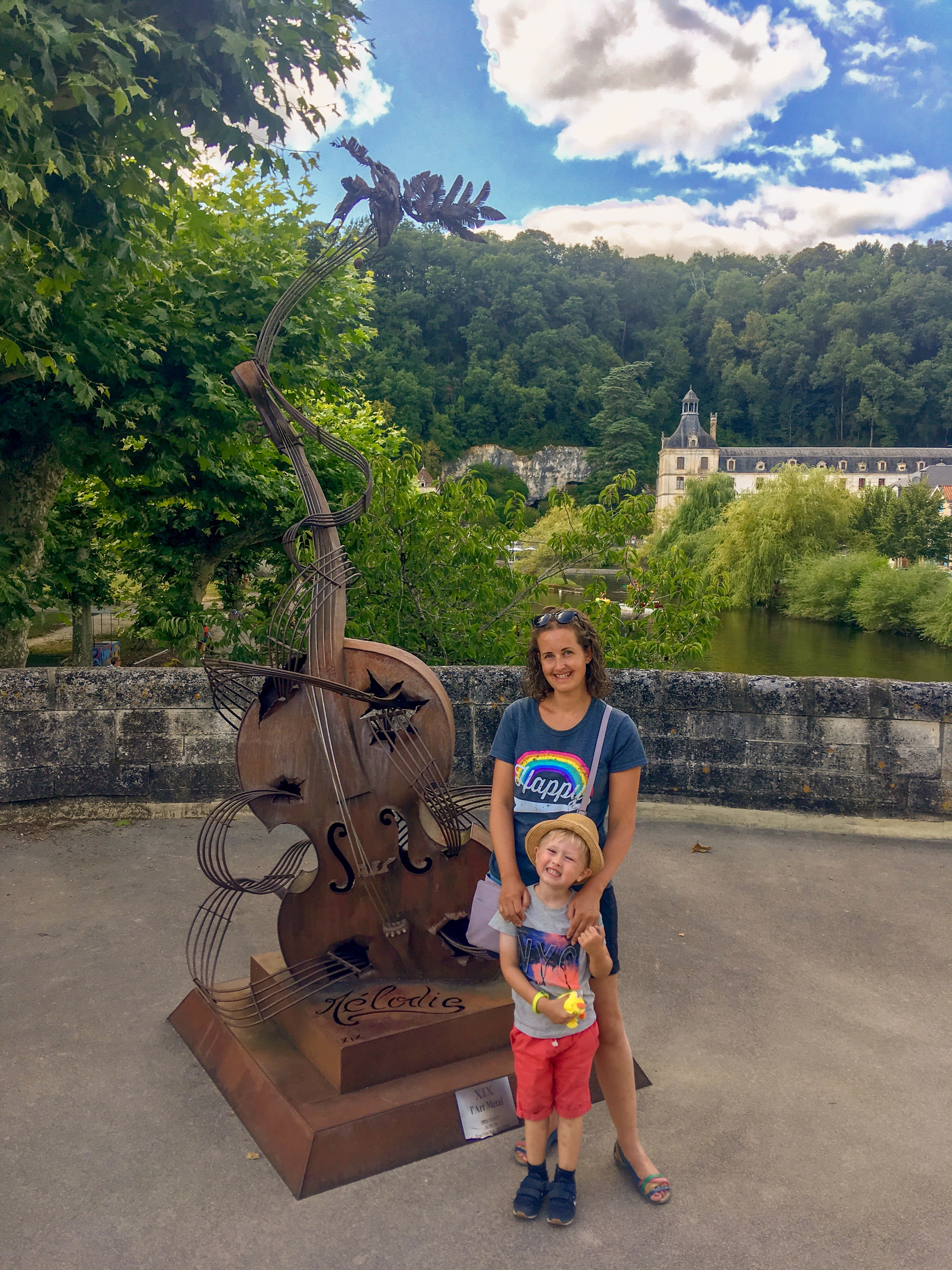 Lucas and I stood next to a violin sculpture in Brantome