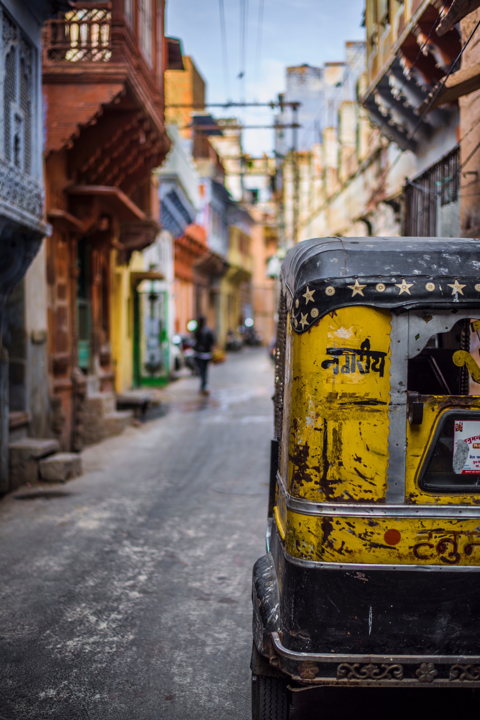 Visiting India with children photo of rickshaw on the street