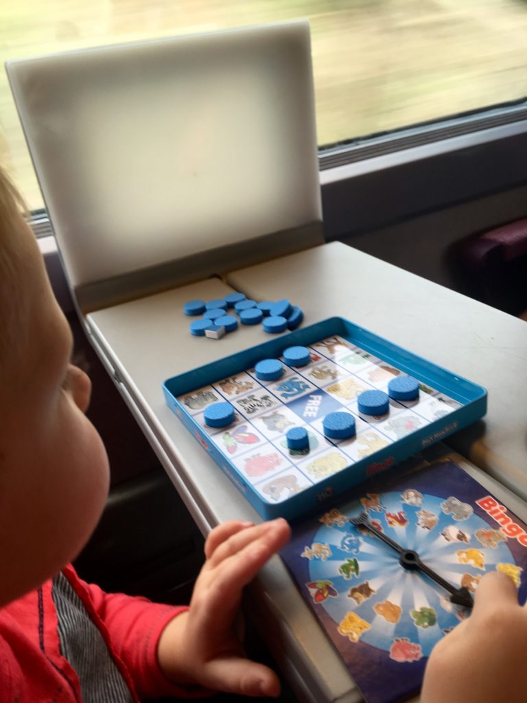 Lucas on the train playing bingo