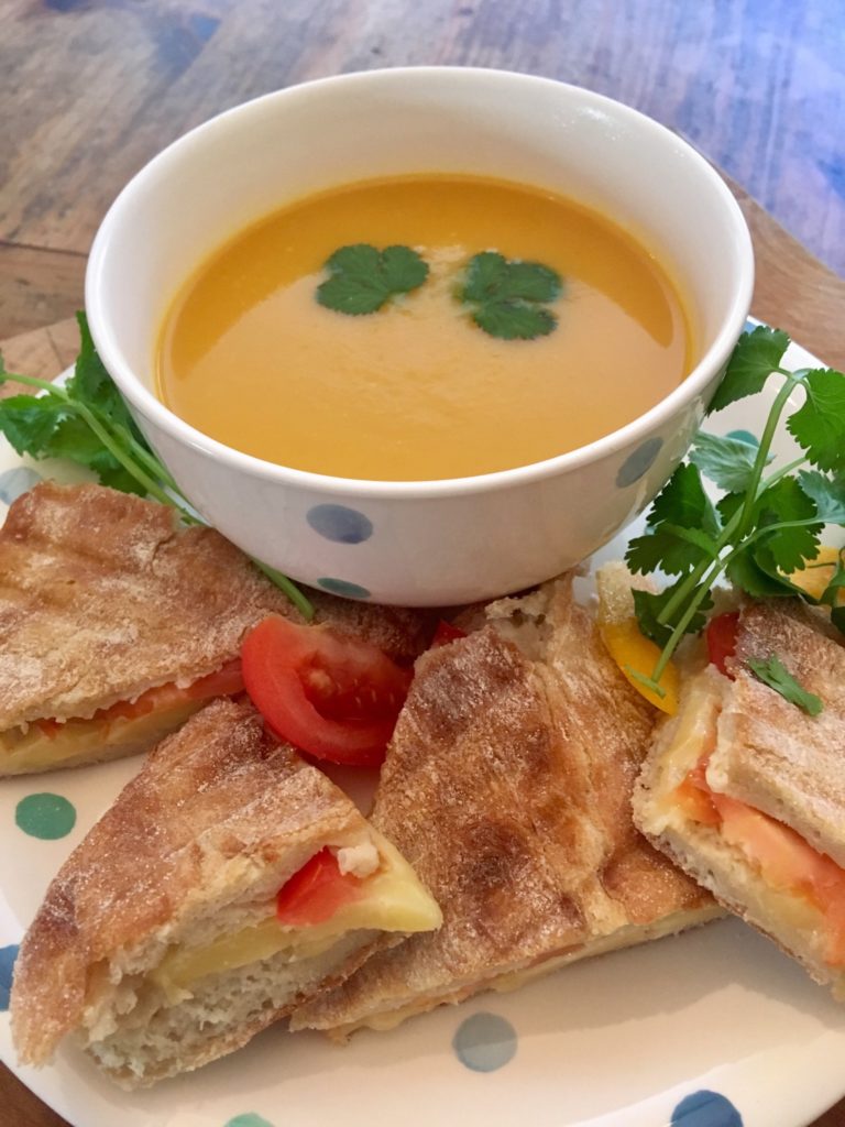 Carrot and coriander soup with cheese and tomato ciabatta
