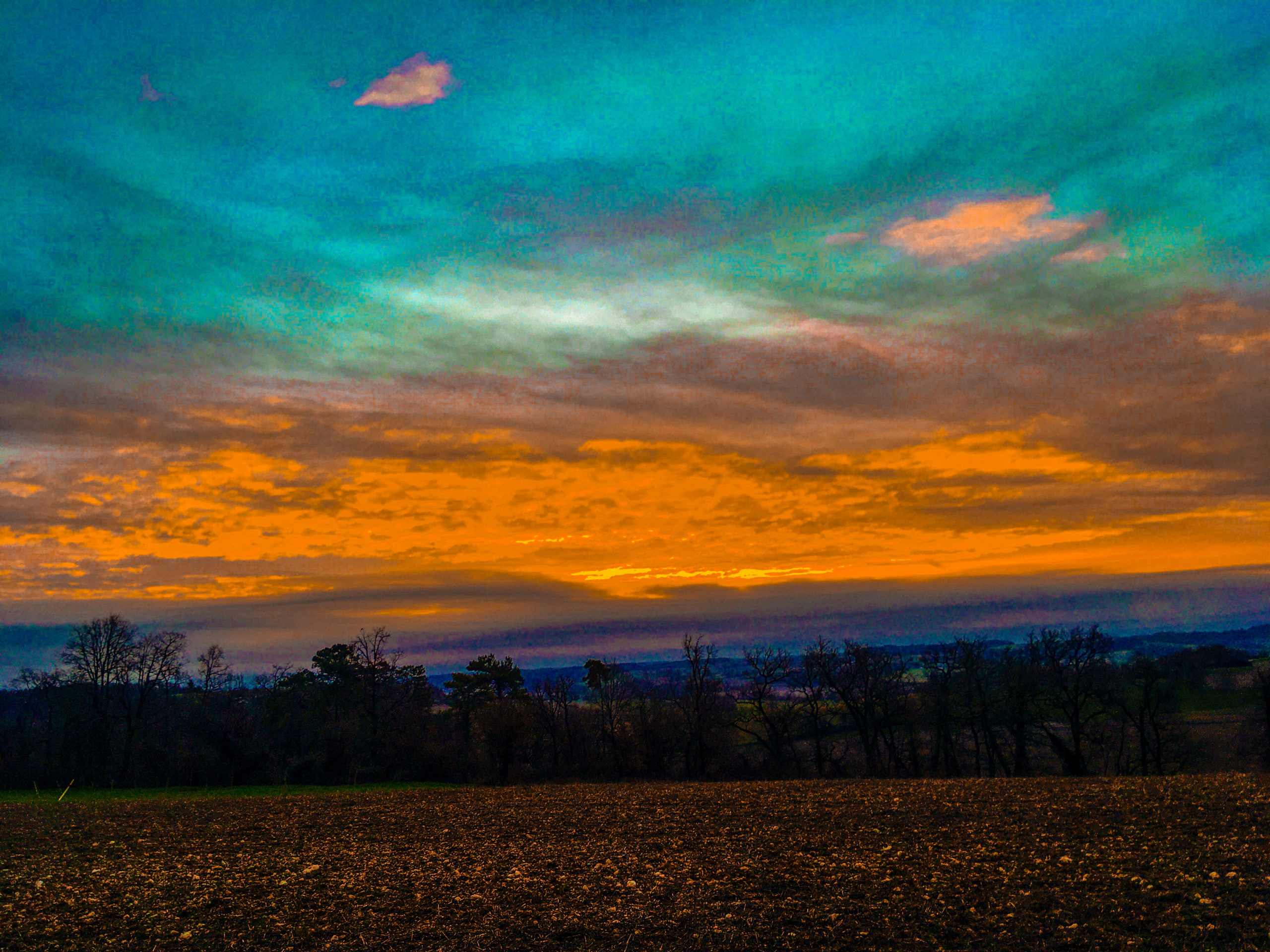 A blue and orange sky during sunset