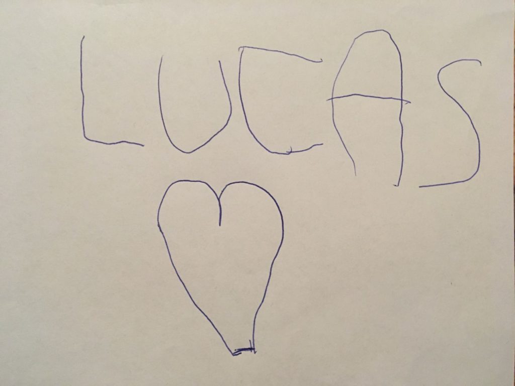 Lucas' writing Lucas on an a4 sheet of white paper