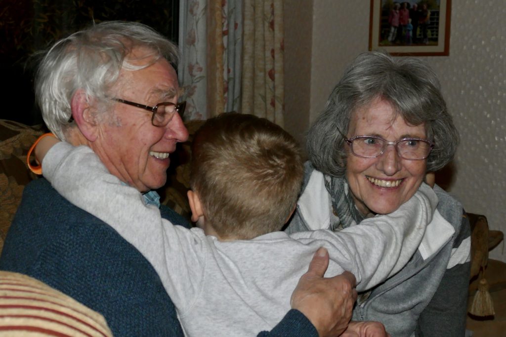 Lucas hugging his great grandma and great grandad 