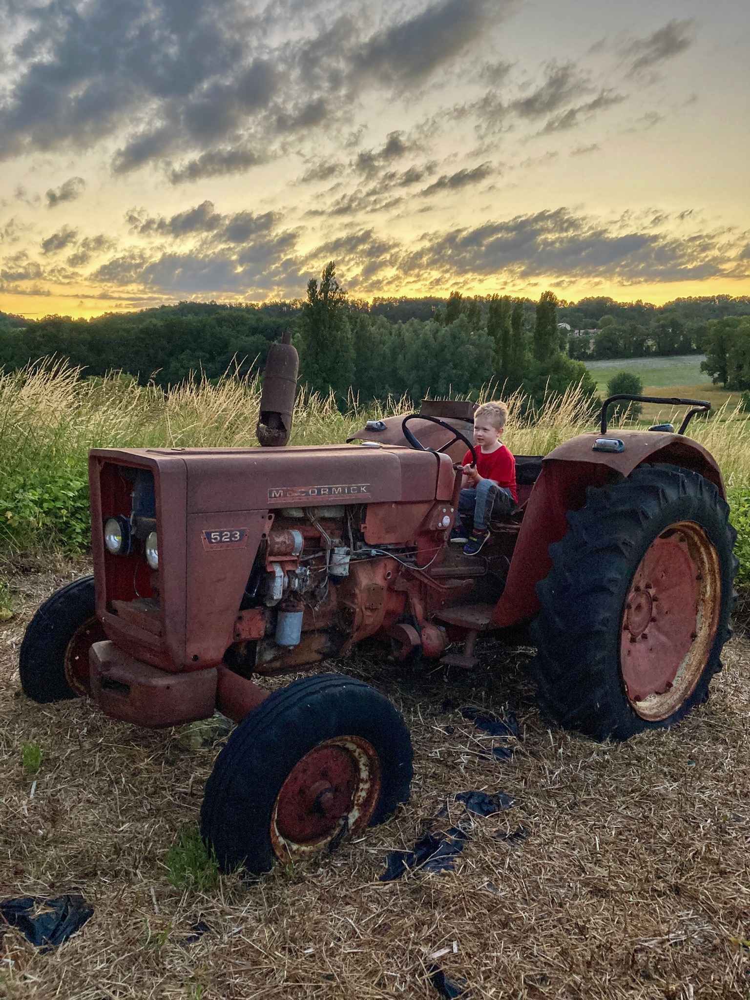 Lucas sat on an old tractor