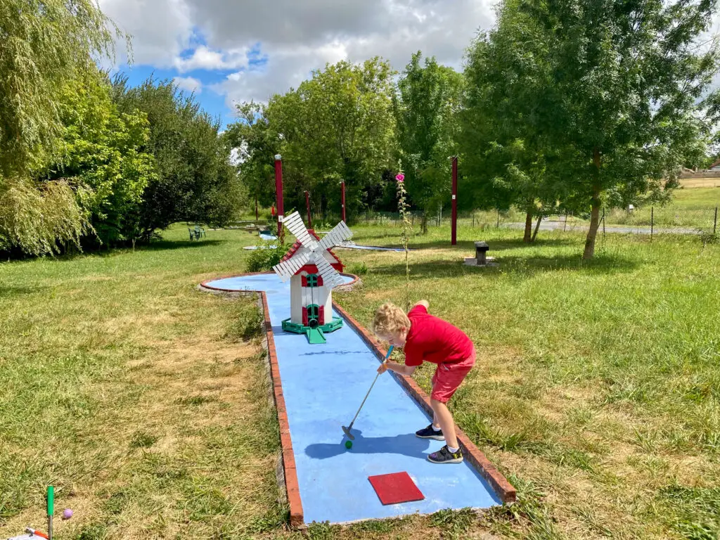 Lucas playing mini golf in Saint Paul Lizonne on days out around the North Dordogne