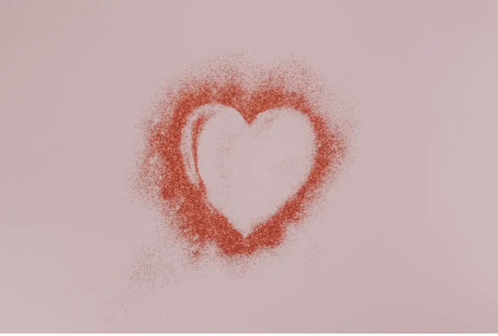 Outline of spray painted Red heart on pink background