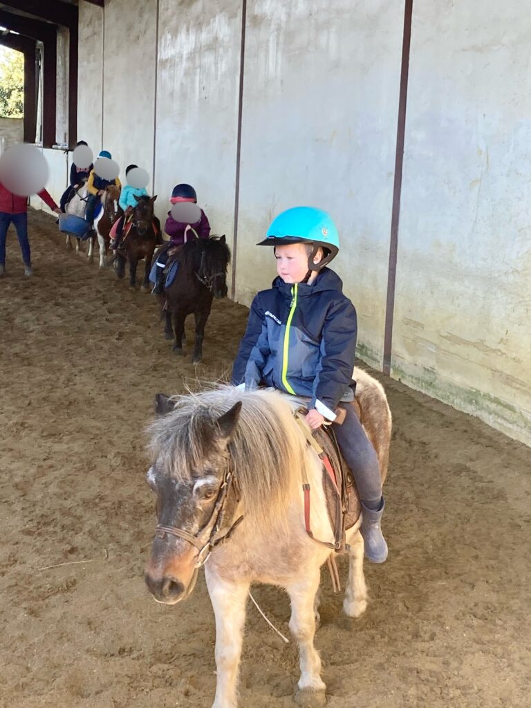 Lucas riding a pony