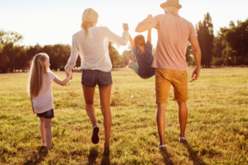 a family walking through a field