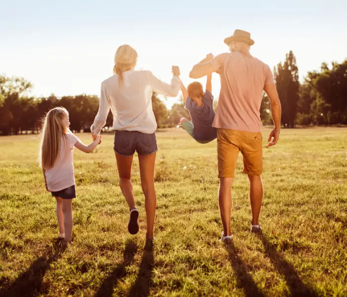a family walking through a field