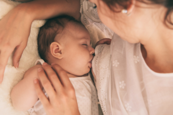a woman breastfeeding a baby