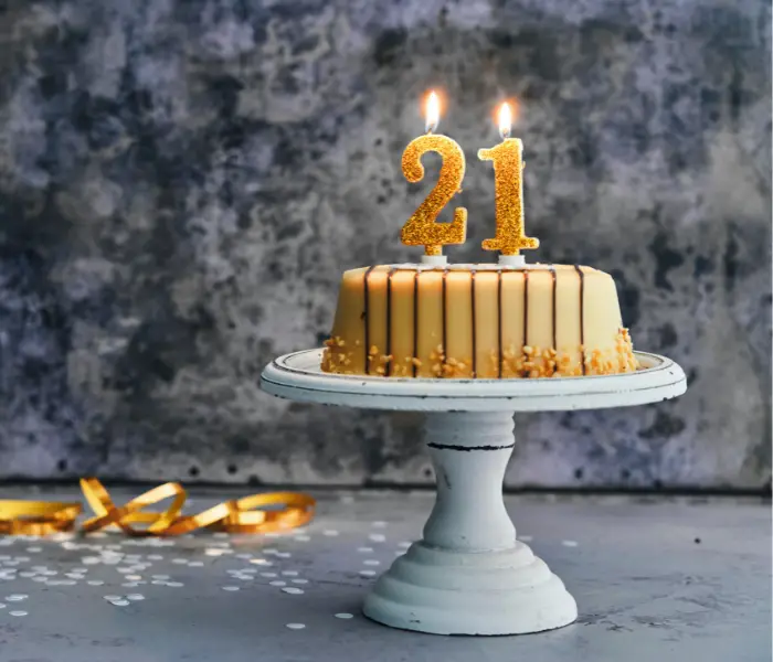cake with candles saying 21