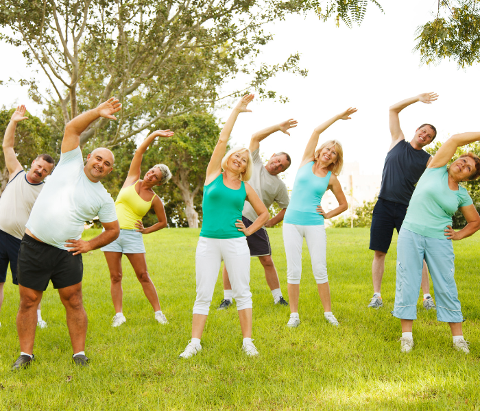 a group of people doing exercise, stretching
