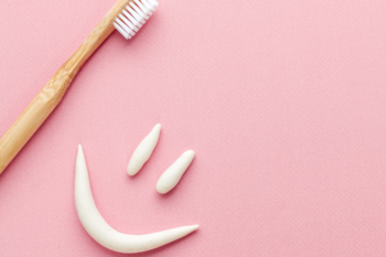 toothbrush and smily face in toothpaste