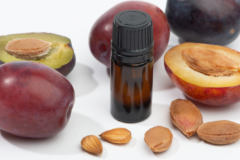 plums and a bottle of oil