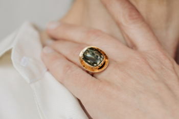 ladies hand wearing a vintage gold ring