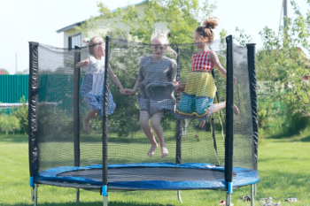 children playing on a trampoline