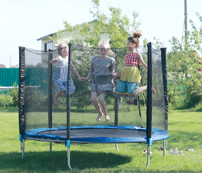 children playing on a trampoline