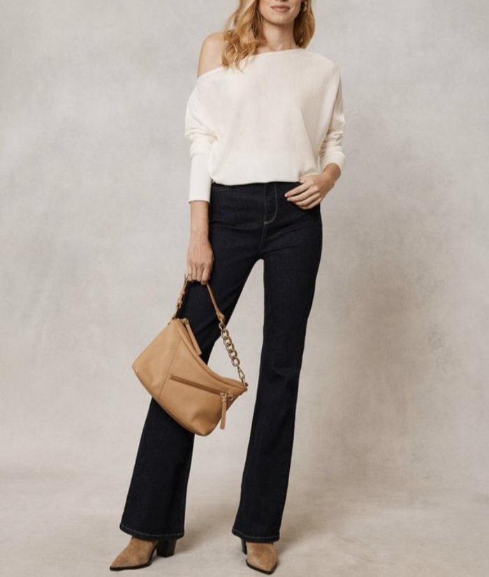 cream jumper and dark jeans