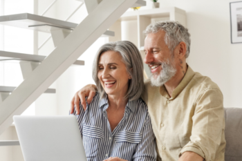old couple looking at laptop