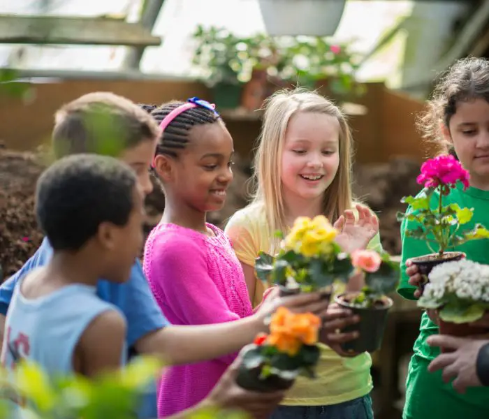 children holding plants