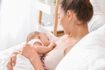 lady breastfeeding a small baby