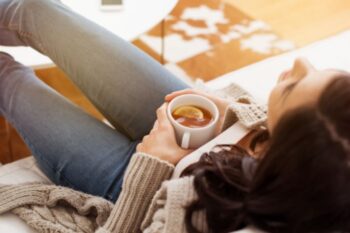 lady-on-sofa-having-lemon-tea