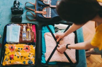 lady packing a suitcase