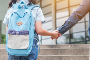 girl with blue backpack