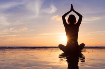 meditation and yoga on beach