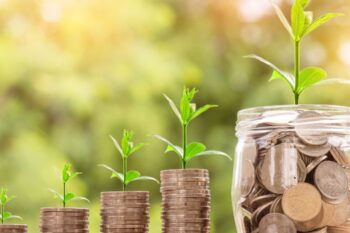 coins in jars growing plant buds. canva pro license
